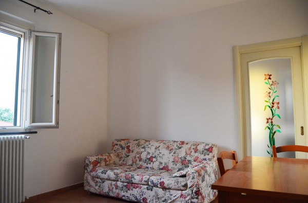 Ingrandisci la foto