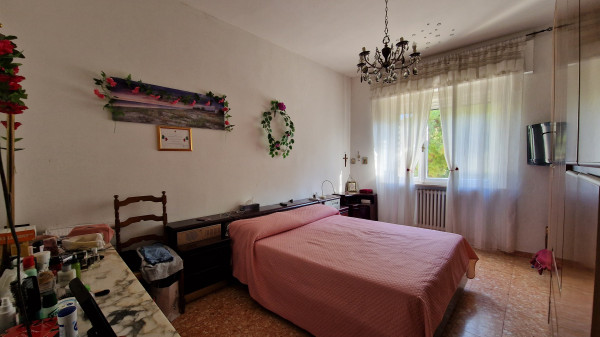 Ingrandisci la foto