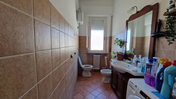 Ingrandisci la foto