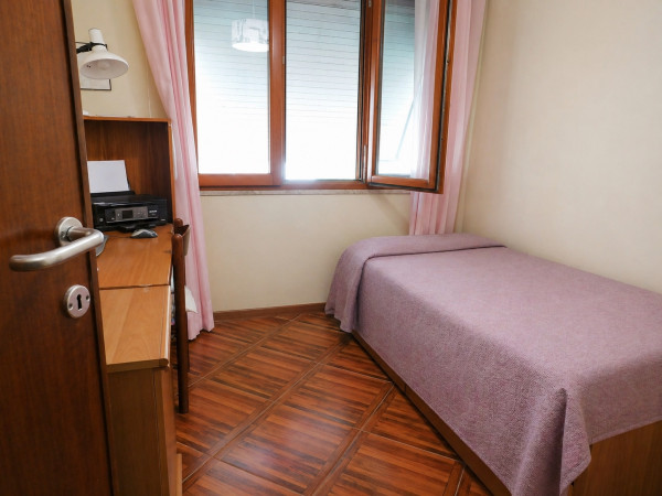Ingrandisci la foto