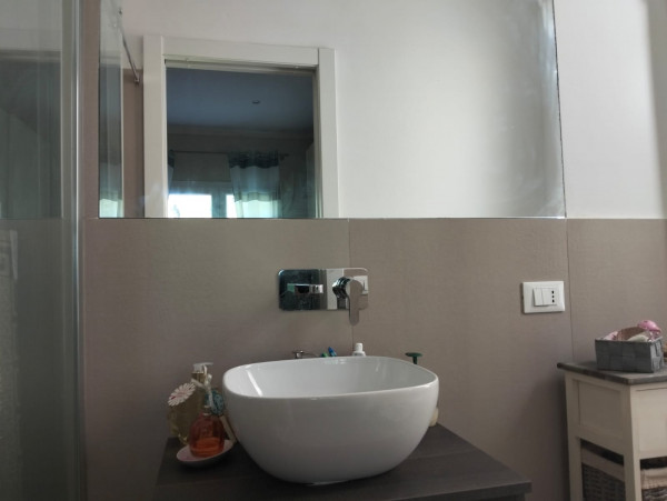 Ingrandisci la foto